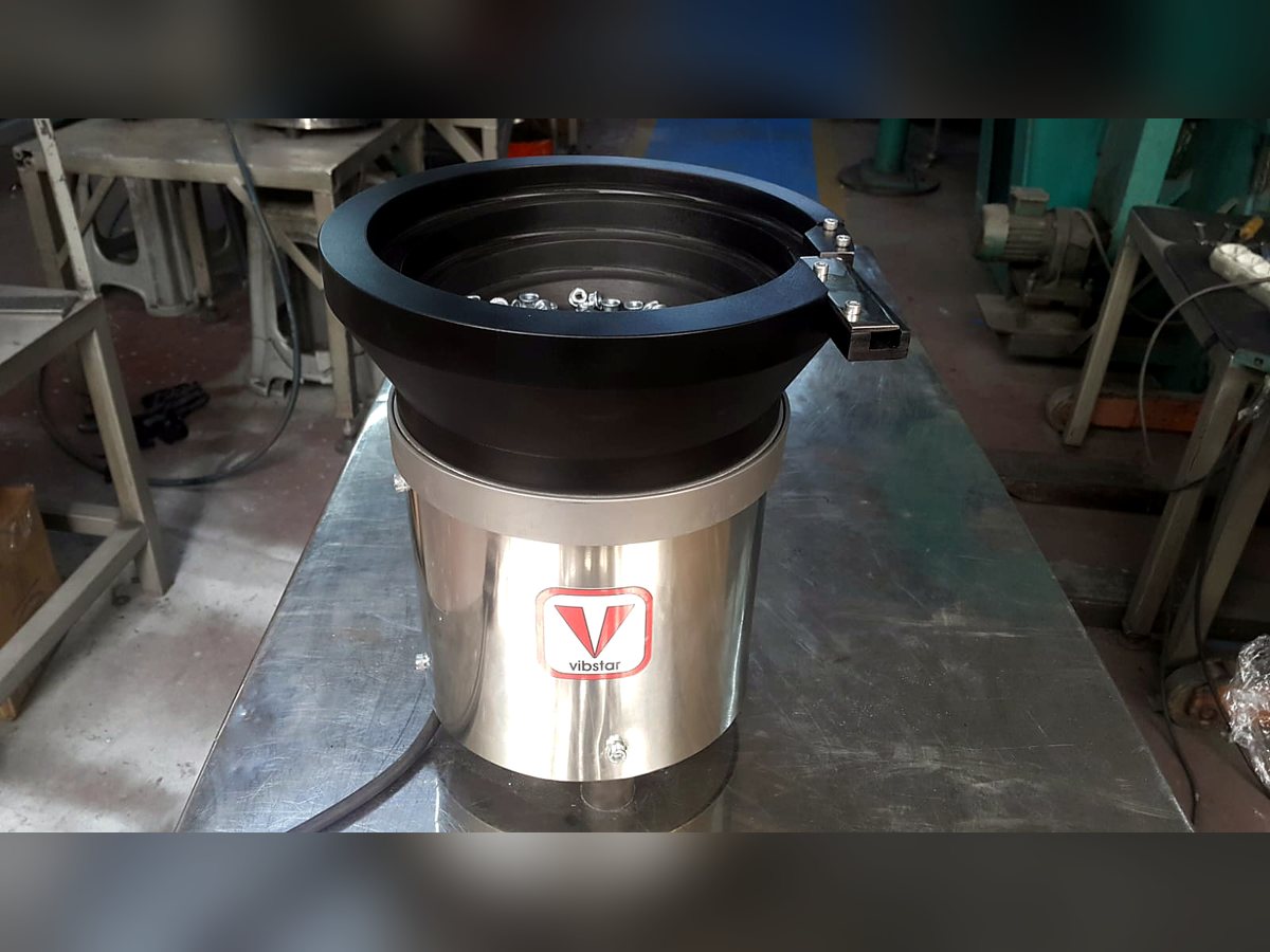 Coated vibratory feeder bowl